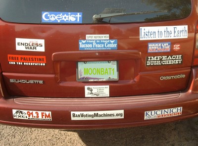 Minivan festooned with bumper stickers