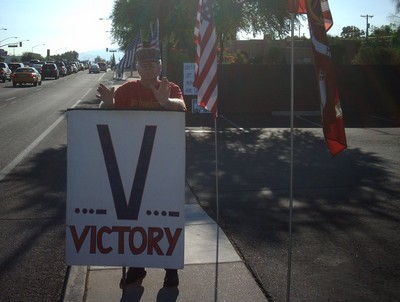 Frank with 'Victory' sign