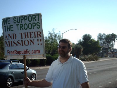 'We support the troops and their mission - freerepublic.com' sign