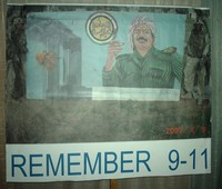 Remember 9/11 with photo of Saddam Hussein's painting of himself and WTC attack